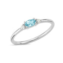 14kt. PETIT ring med oval blå topas og 2 x 0,025 ct. W-si